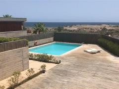 Seafront beach house for sale