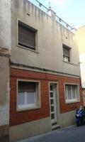 House in the center on a semi-pedestrian road i