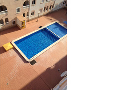 Two bed top floor Apartment poolside
